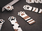 Lesezeichen Katzenpfote Glückskatze